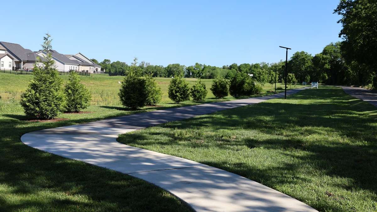 Take a walk on the tree-lined walking trail at Langford Farms!