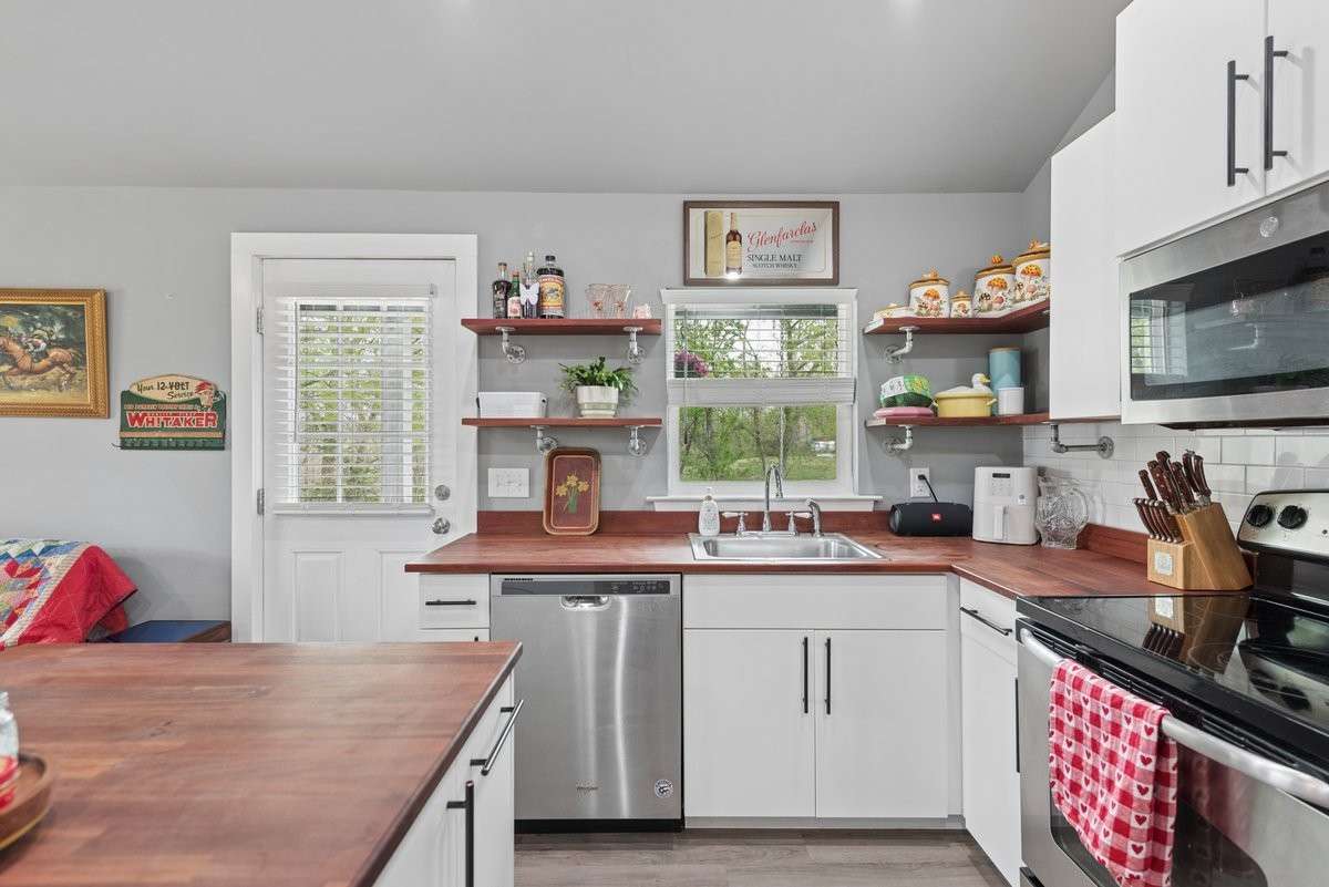 Surrounded with all the Needed Ingredients for a Happy Cook- includes an Island Work
 station