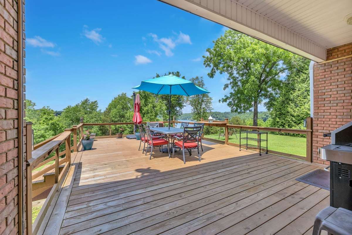 Sit in the sunshine or shade & enjoy this deck. One of the highest points in Lynchburg, this home is guest to many varieties of trees, plants, deer and birds.