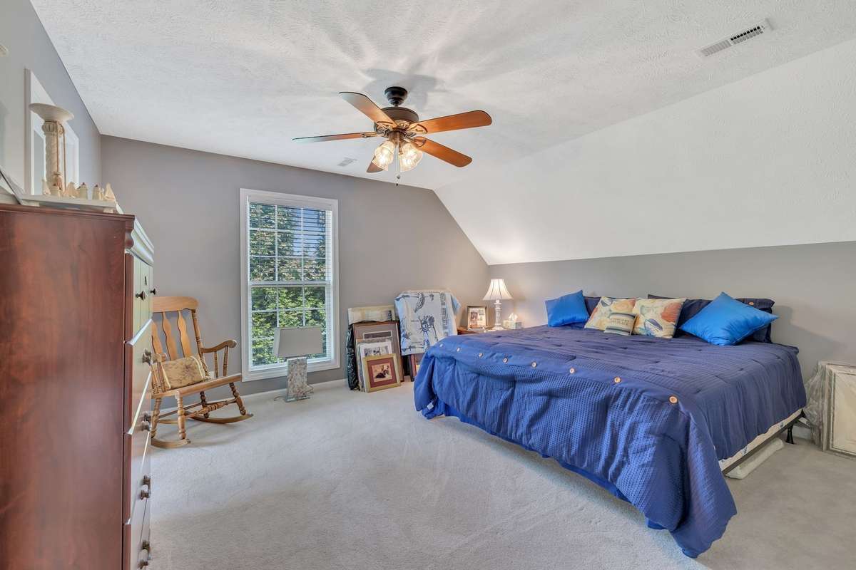 Large 2nd Bedroom with an office/seating area with a view of the lake, walk-in closet in the additional room.