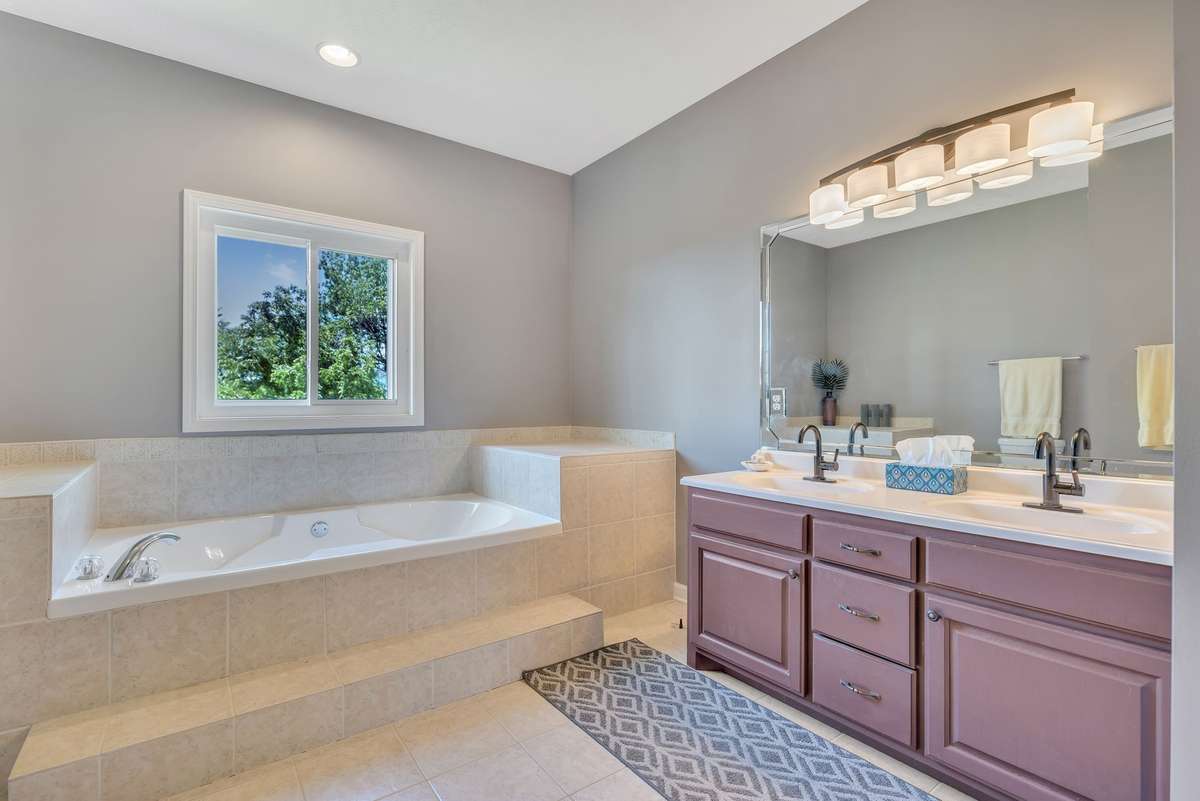 Large soaking tub & separate shower, double vanities in the Master Bath.