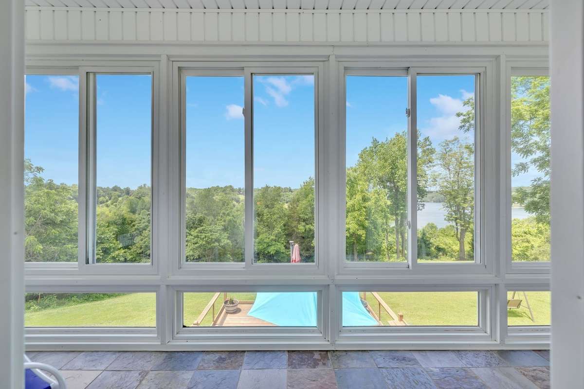 The Sun Room view of the lake and the back deck.