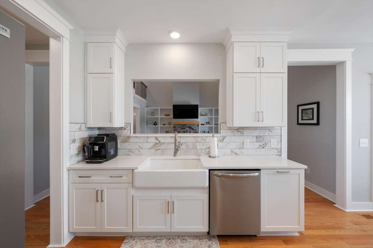 Farmhouse sink and a serving area/pass through for entertaining.