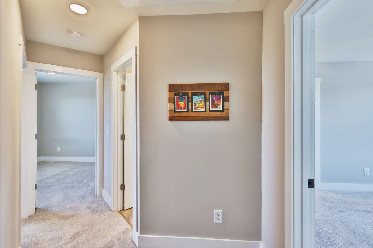 The open landing and hallway is the hub and all the rooms and baths branch from it.