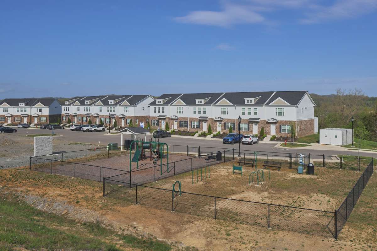 There is a gravel walking trail, convenient doggy bag stations, a playground and separate dog park. Both areas are fenced and have a variety of play equipment. There is extra parking in front of the play areas.