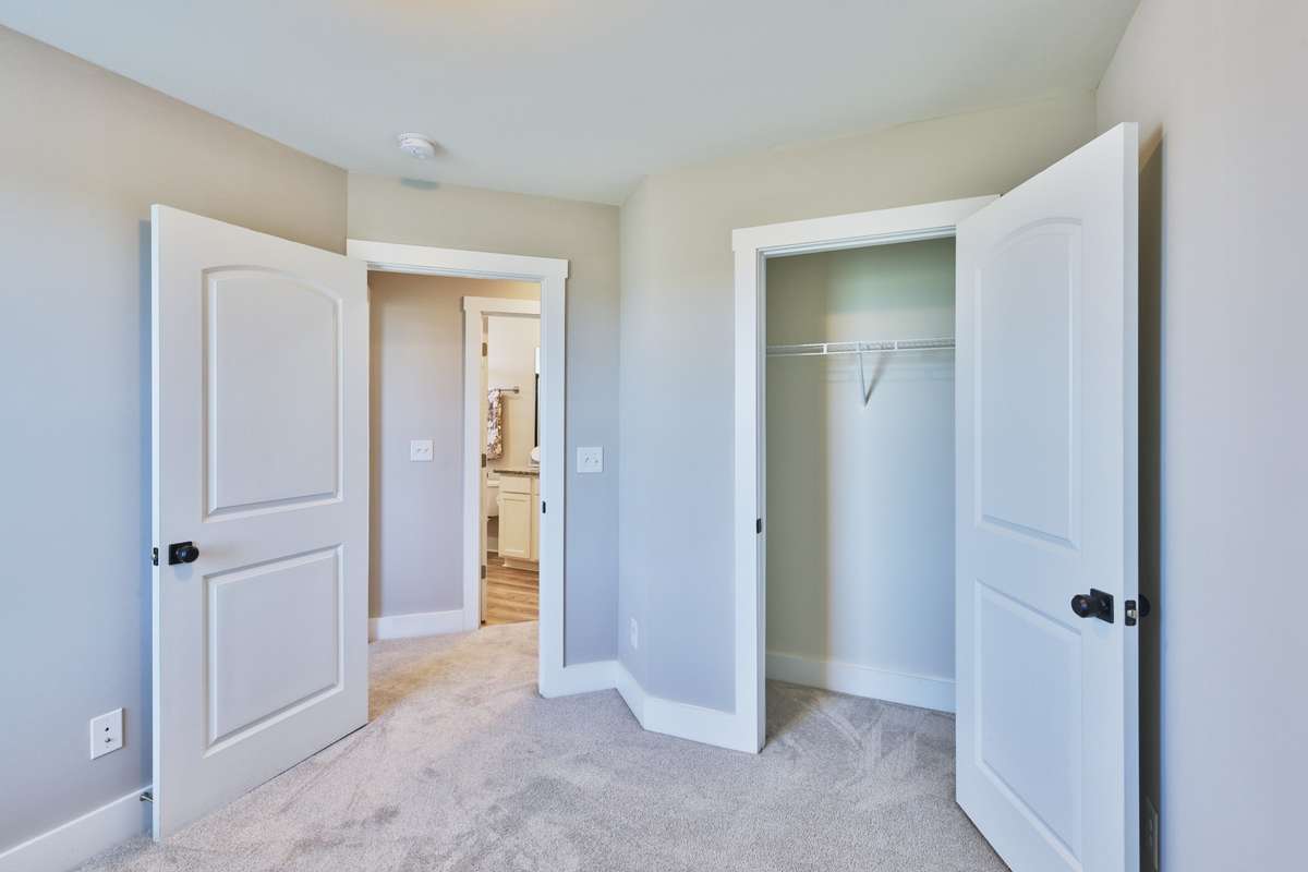 Second bedroom, view toward closet and hall.