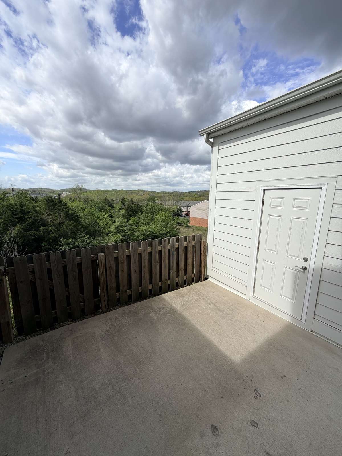 The patio area features a storage building for tools and gardening items, bicycles, etc.