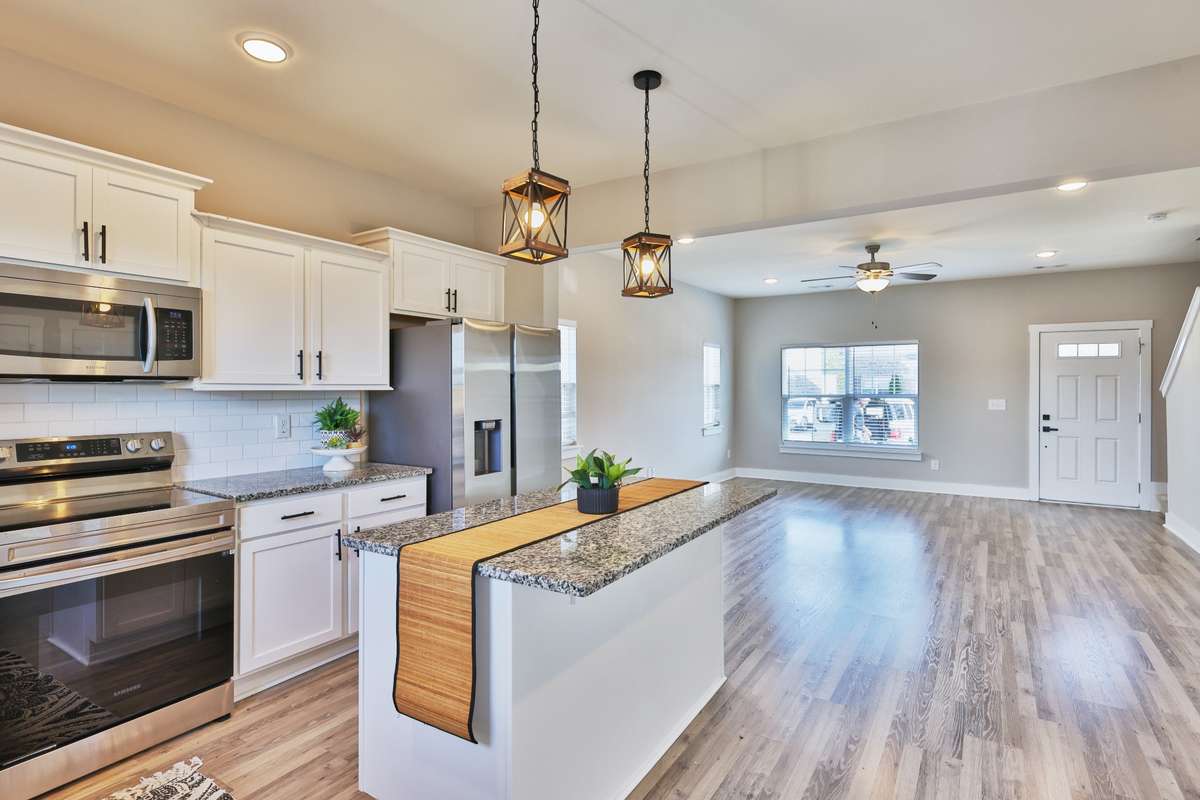 Freshly painted and move in ready! The warm taupe walls and crisp white trim complement the flooring and provide a neutral backdrop for your decor. This space offers a variety of furniture layouts, with the breakfast bar - handy for extra seating.