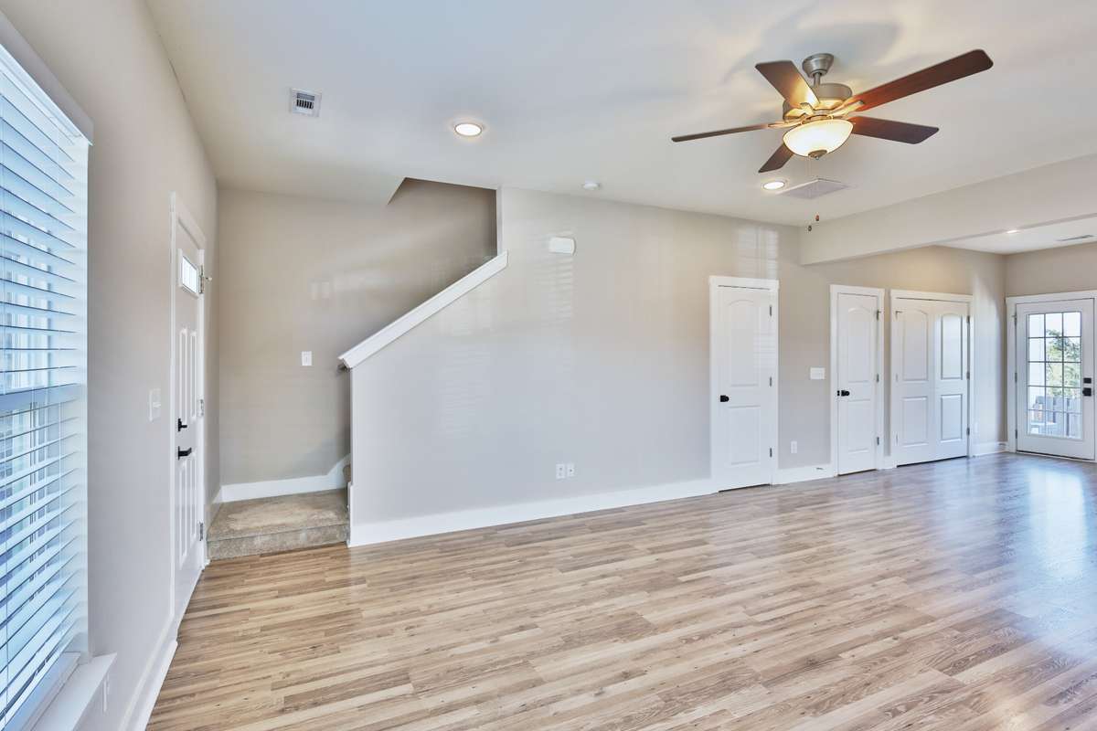 Stairwell leads to three bedrooms, two full baths.