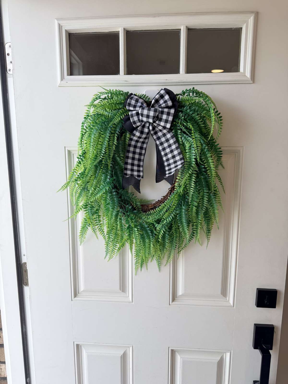 The three light door adds charm, the owner has added some chunky black hardware to create continuity with the interior hardware, pulls, and light fixtures.