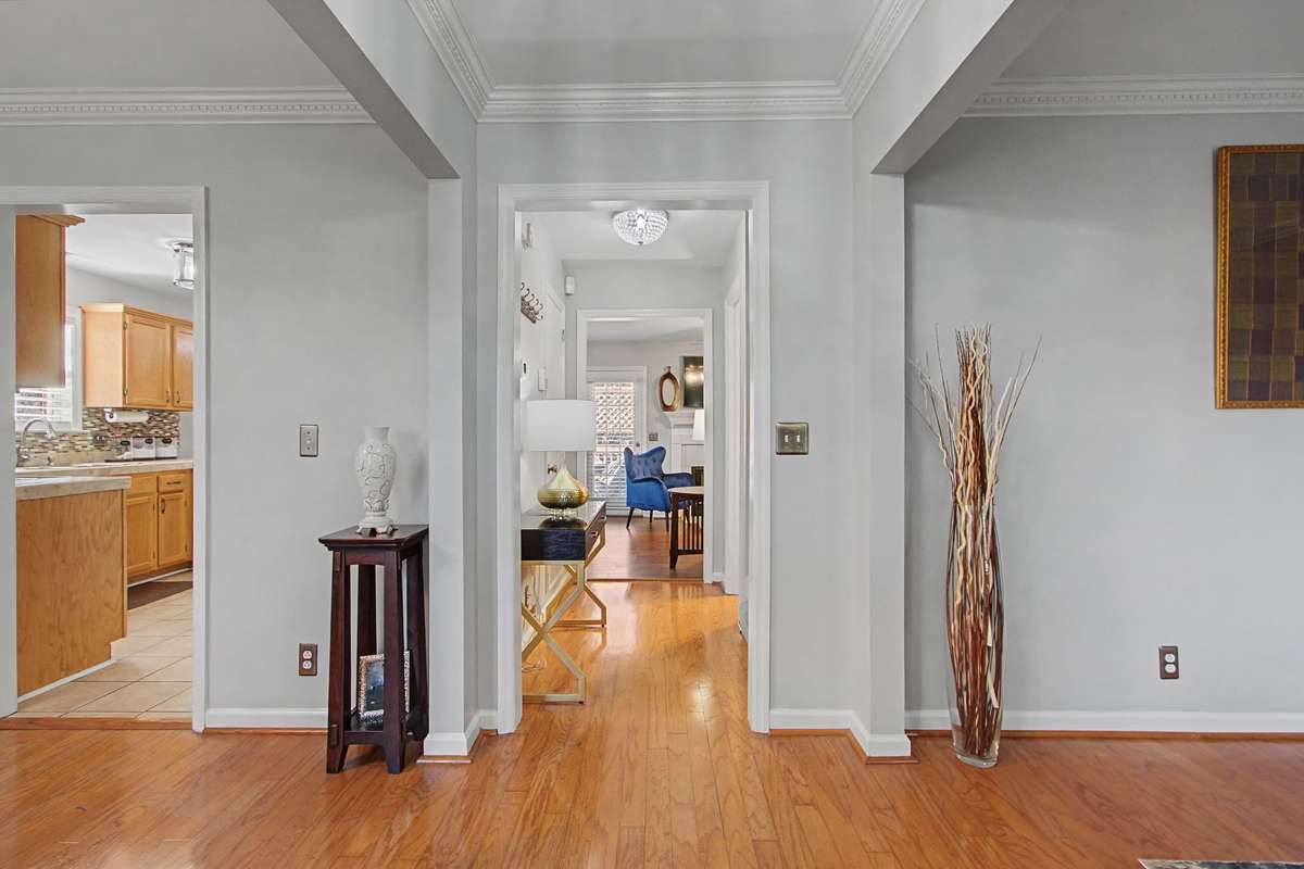 Neutral paint and crown molding in formal rooms.