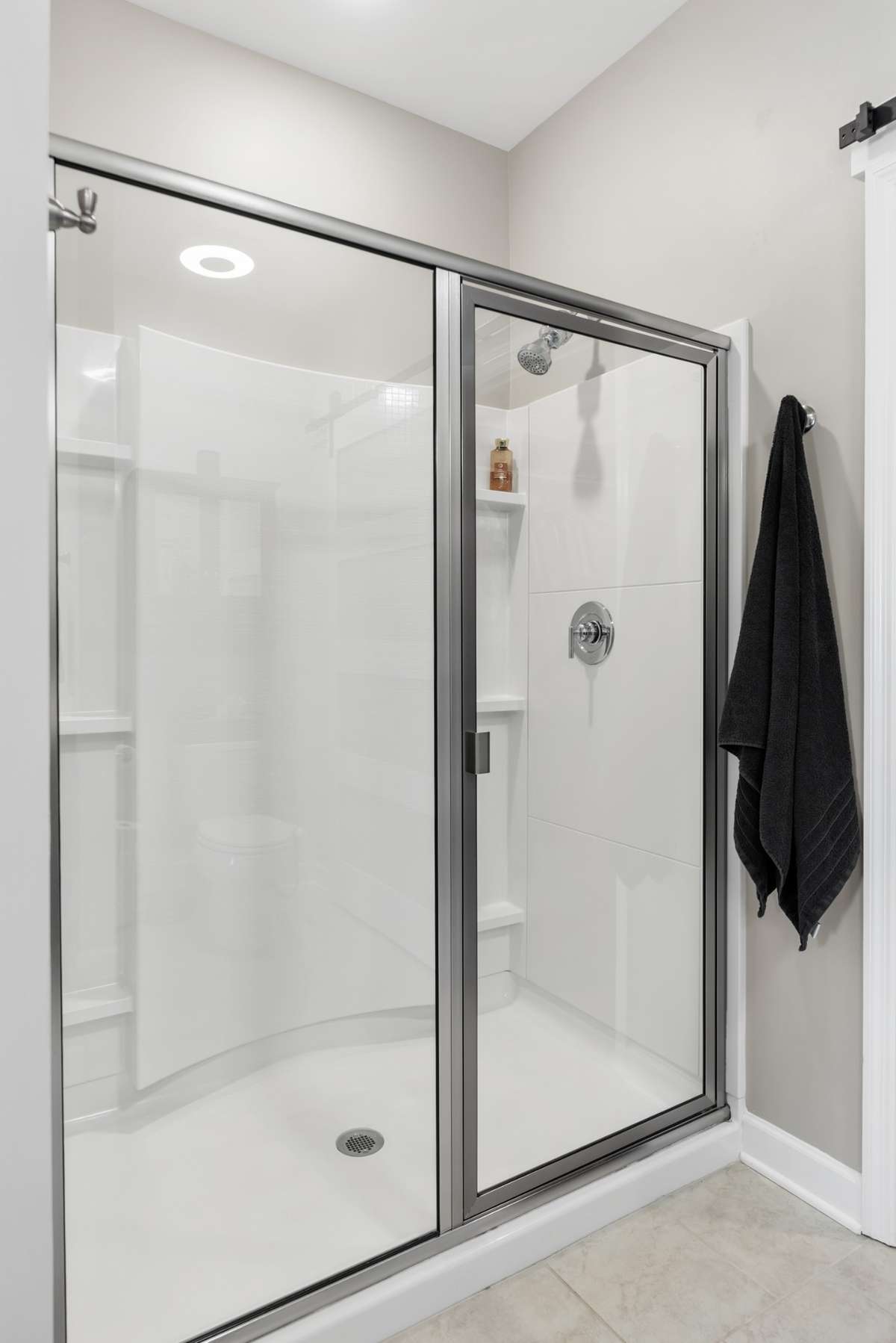 The primary bathroom has an oversized walk-in shower.
