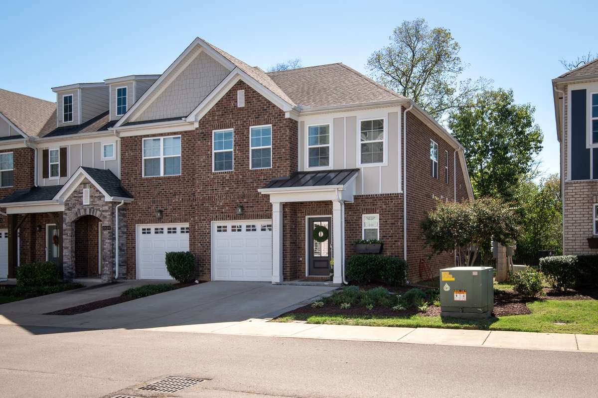 The desired end unit offers a primary suite on the main level, 2 car driveway, extra windows to bring natural light into the home, greenspace for our furry friends and this specific unit has mature trees with rear patio privacy!