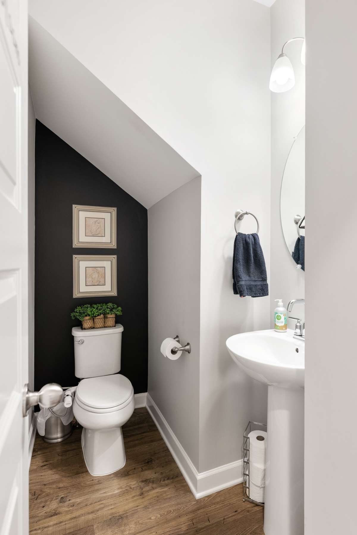 This charming main-level half bath offers easy access for your guests while keeping your two full bathrooms private.