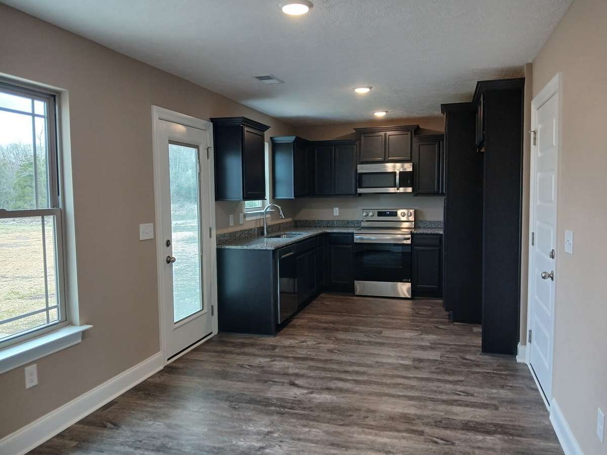 Kitchen has Extra Custom Cabinets and Counter Space.
