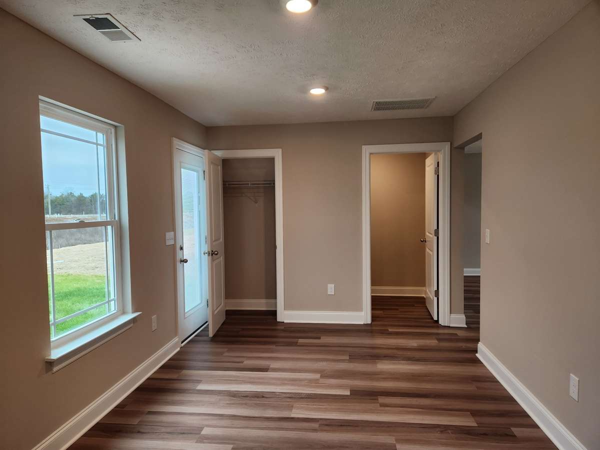 Dining Area has door to Back Patio and Walk-in Pantry. Picture of Previous House.