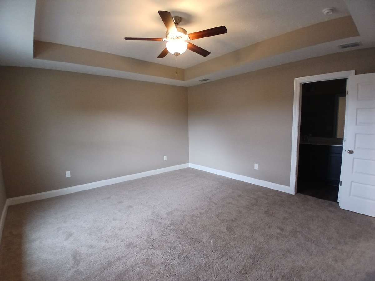 Primary Bedroom with Trey Ceiling.