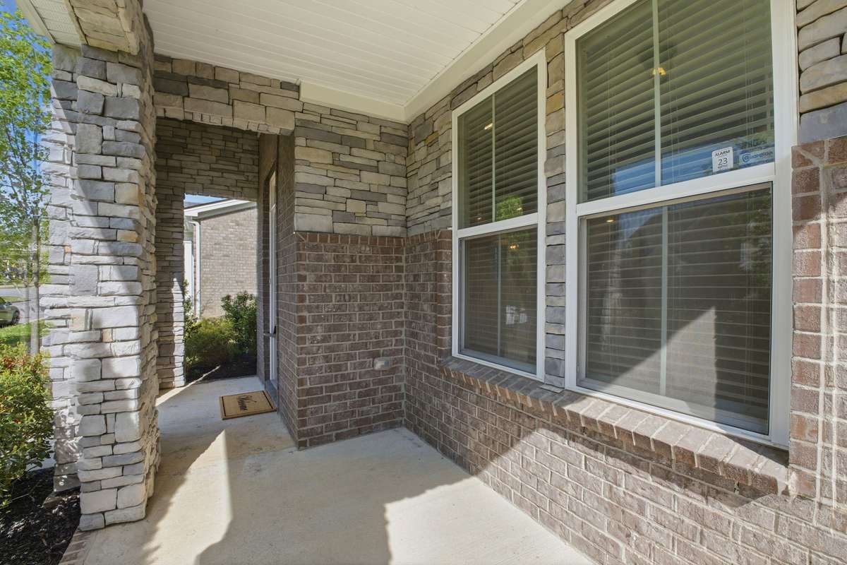 The covered front porch is ready for you!