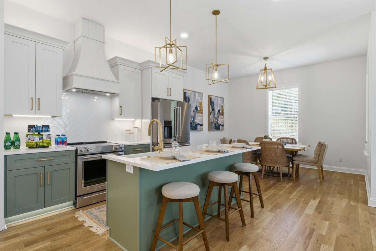 Hood in the kitchen with tile backsplash.