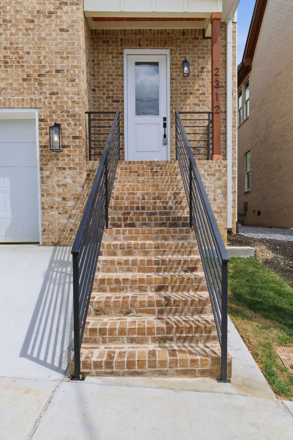 Brick Steps, Aluminum Railing, Beadboard on front porch