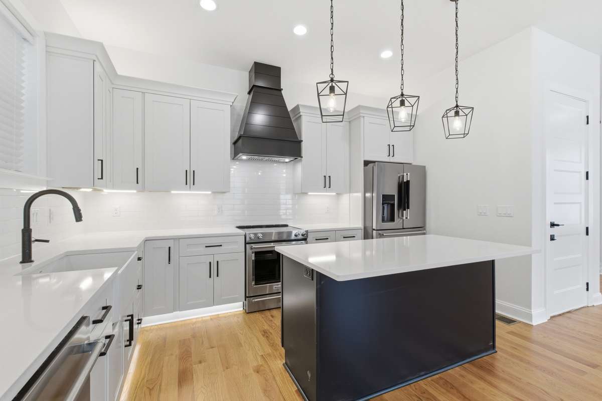 Black Island and Vent Hood with Origami Colored Cabinets