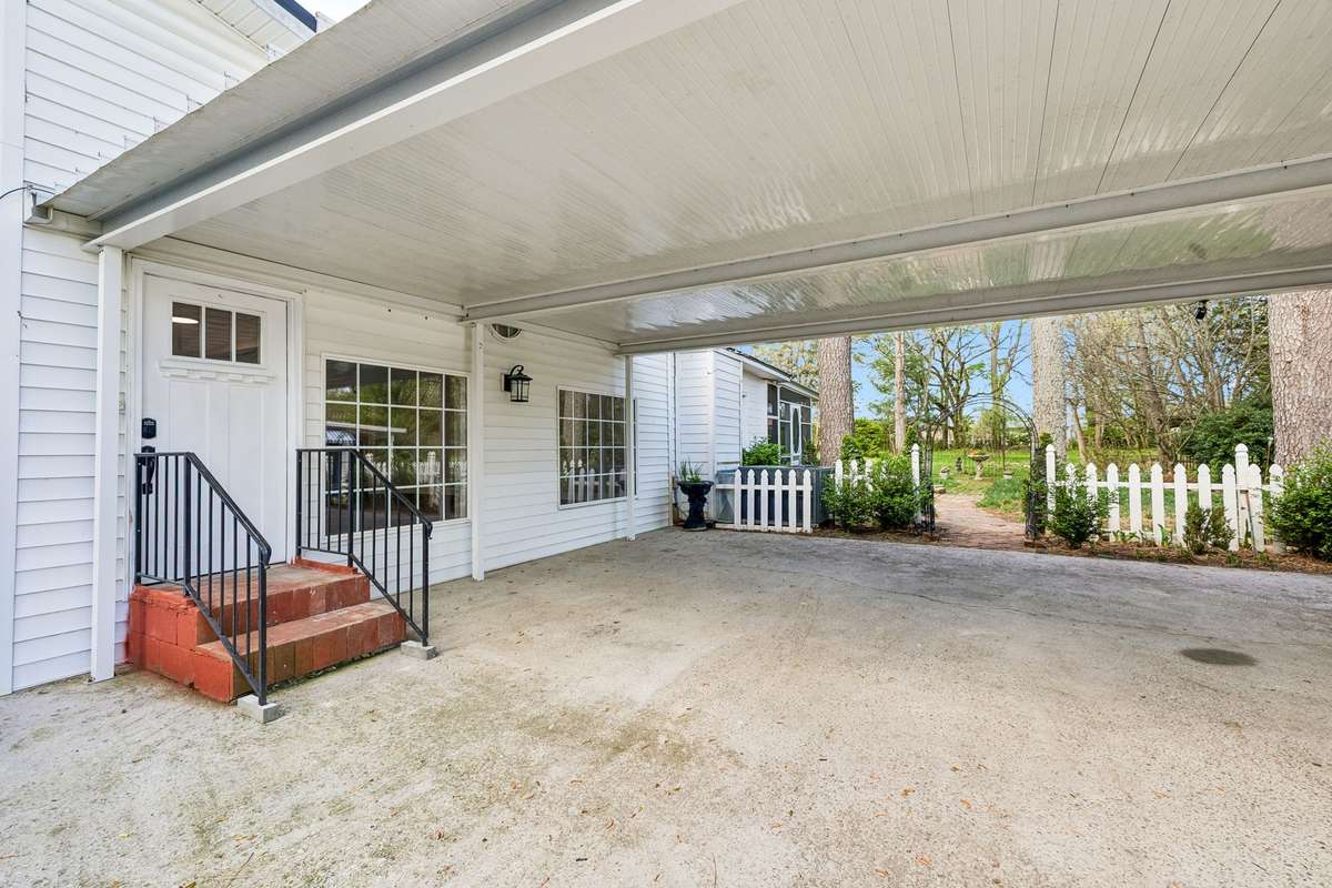 Spacious covered parking with convenient side entry to the house.
