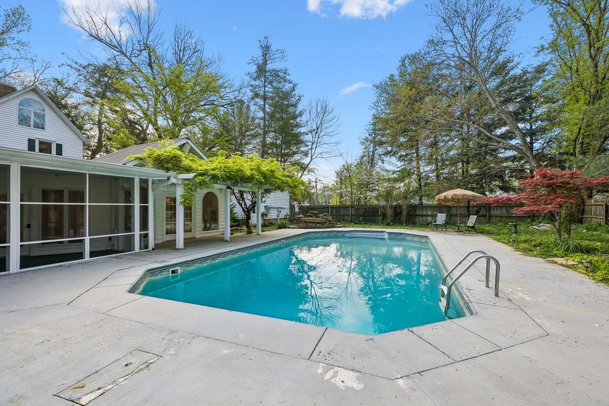 Beautiful backyard oasis features an inviting saltwater pool!