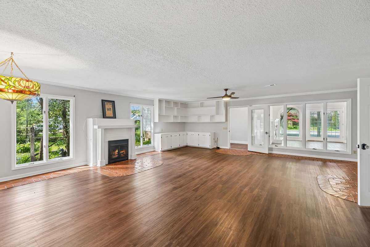 There are 7 fireplaces throughout the house. 2 are functional, natural gas burning and both are located on level #1. All 3 levels have central air & heat.