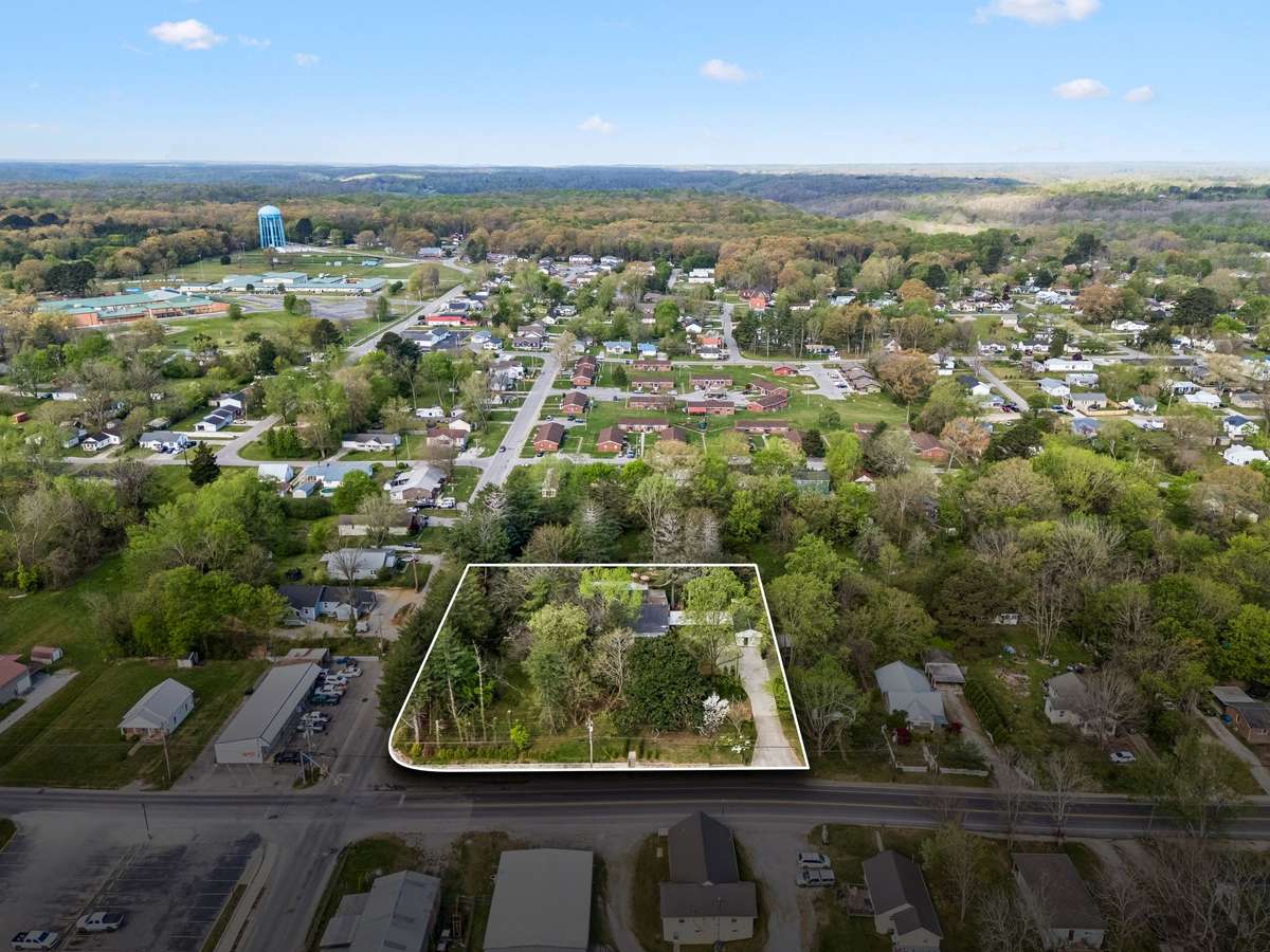 A recent survey was performed for this level and wooded 1.38 acre corner lot. These property lines are approximate.