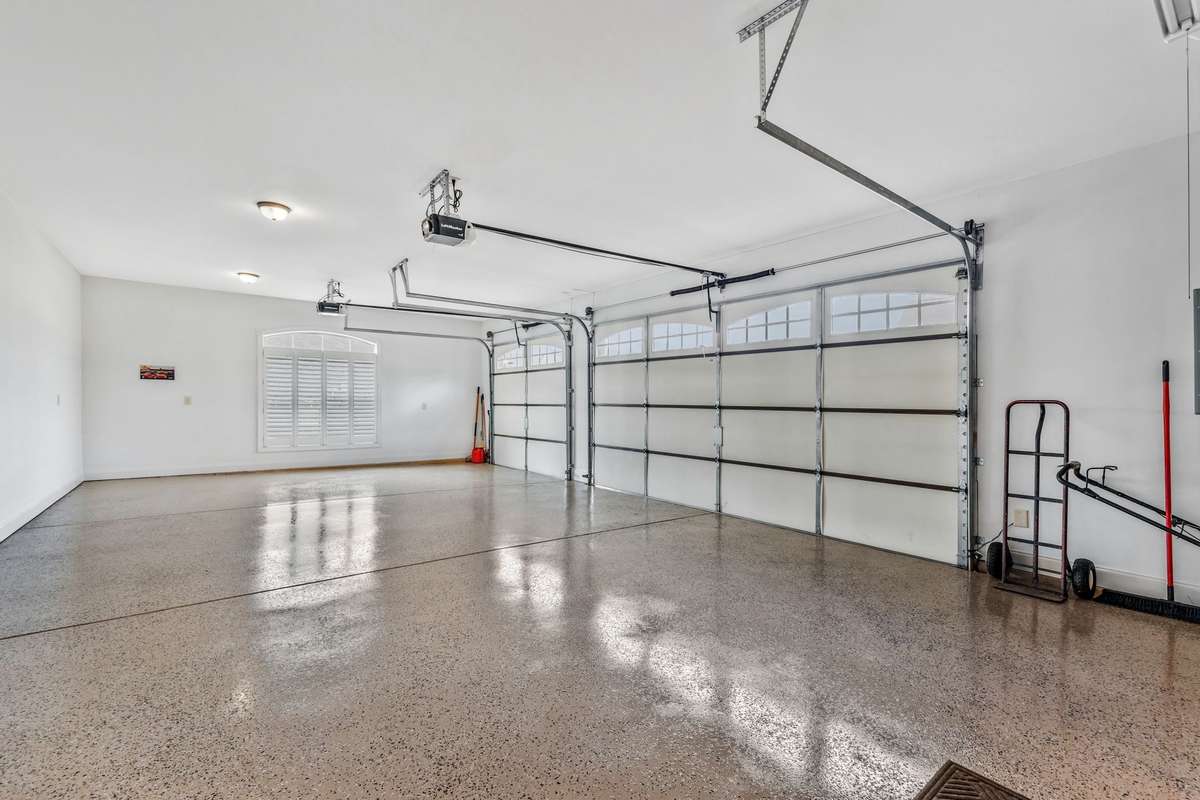 Nice size 3 car garage with epoxy floor