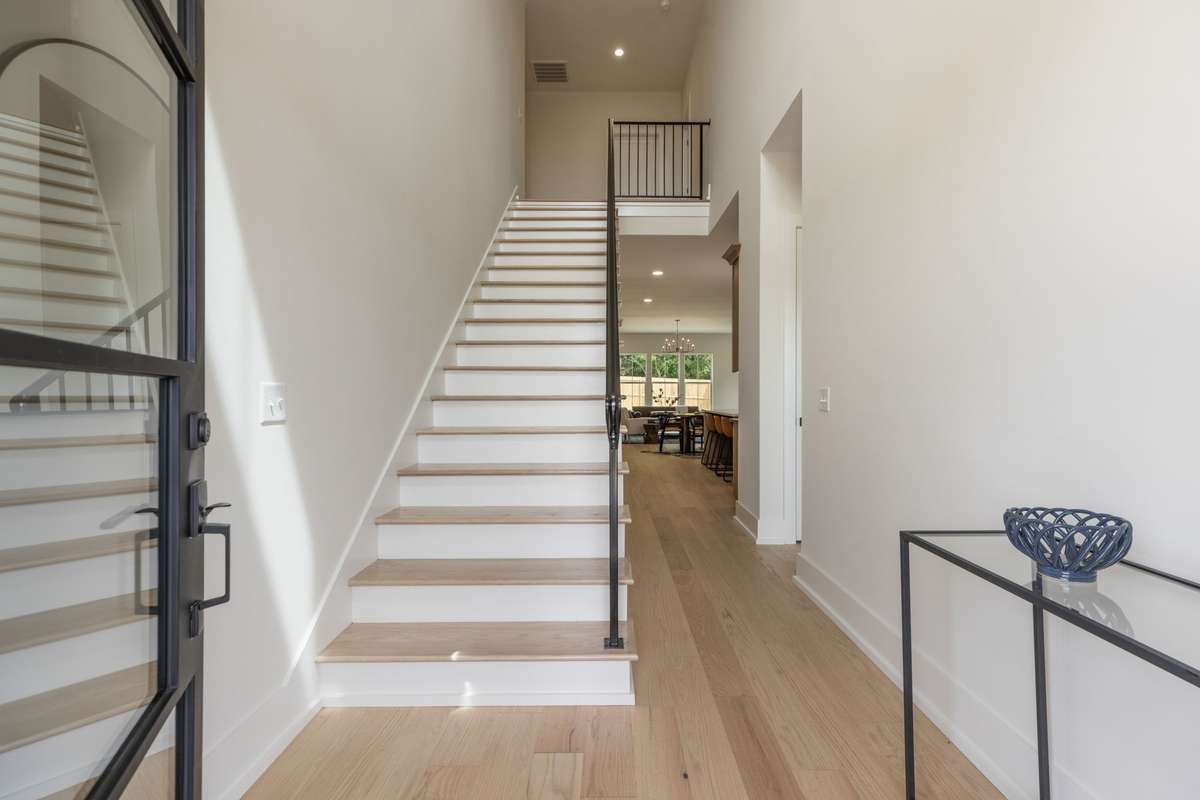 Beautiful Foyer with custom Wrought Iron Hand Rail.