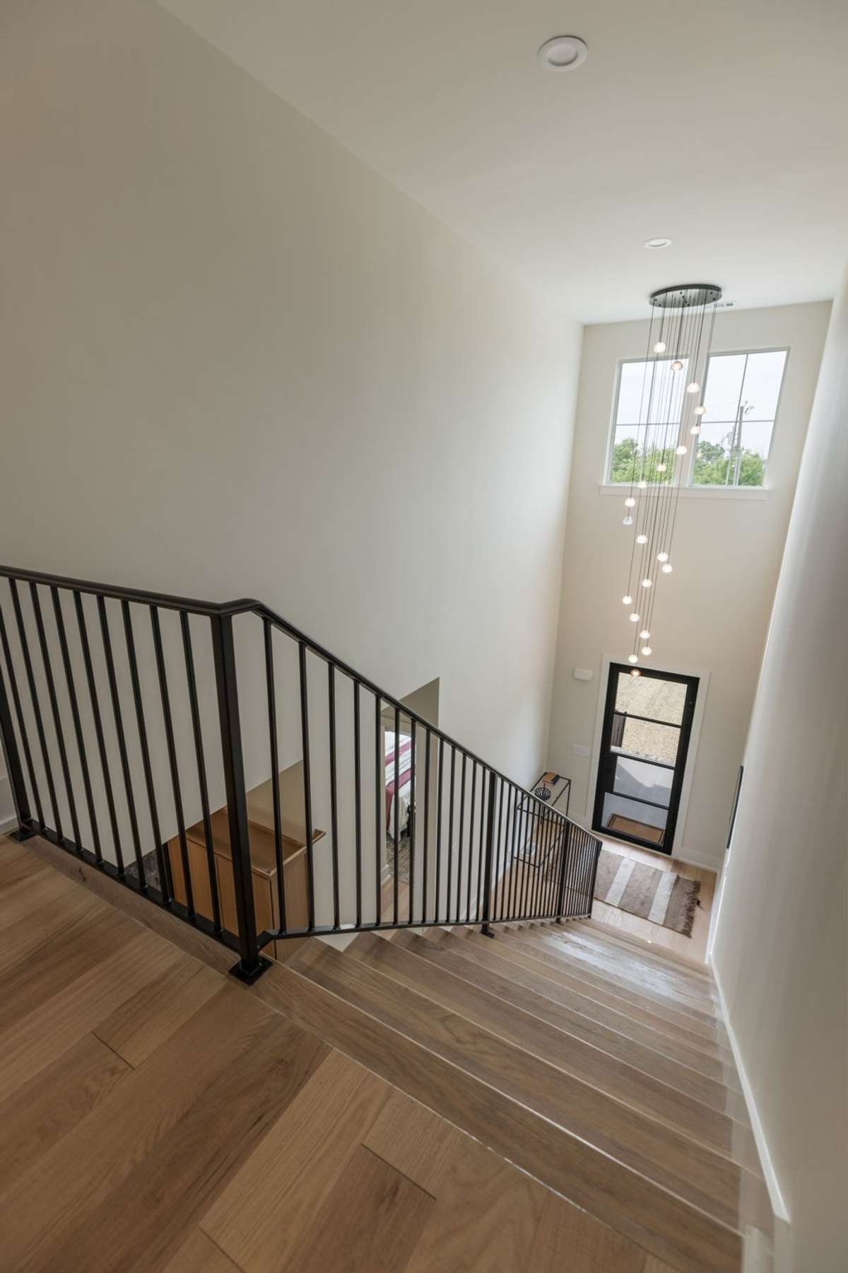 Second Floor view on Foyer with incredible Chandelier.