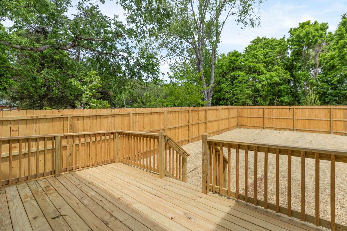 Great Deck with view of large fenced yard.
