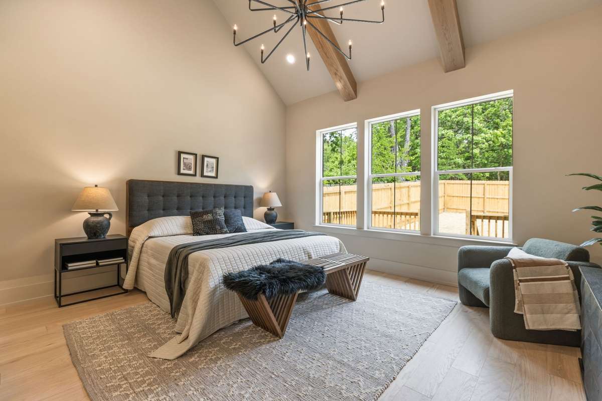 Primary Bedroom. 15' Vaulted Ceilings.  White Oak Beams.