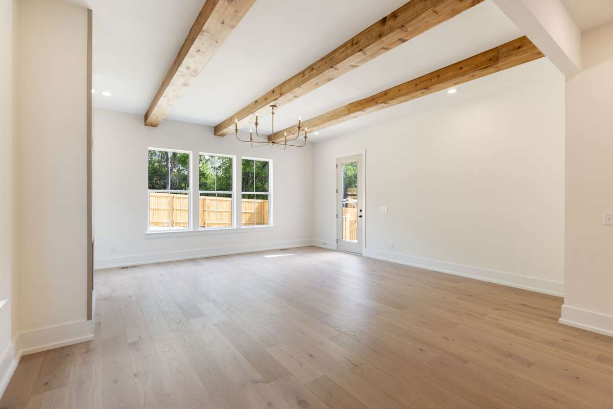 Living Room with Access to back deck and fenced yard.