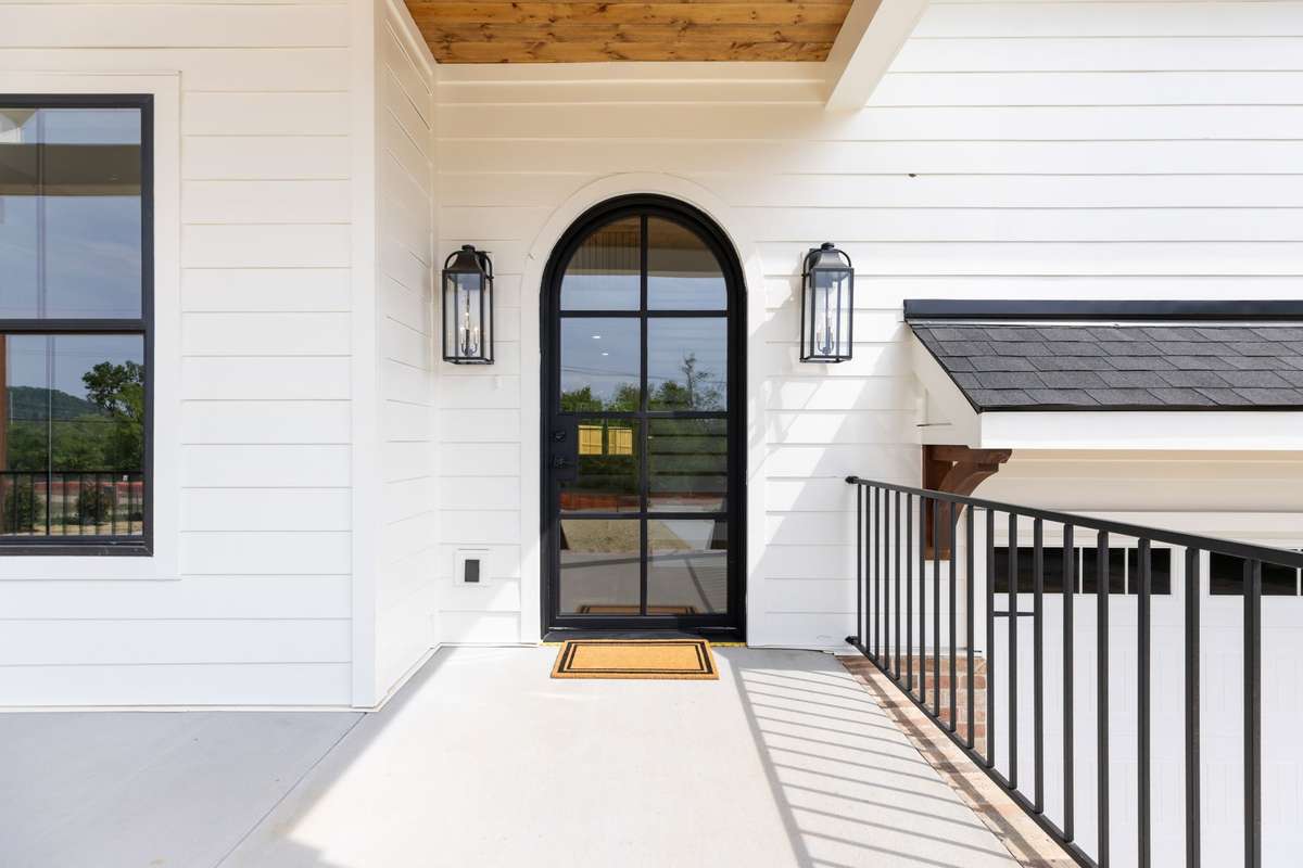 Great Entry with Arched Iron Door.