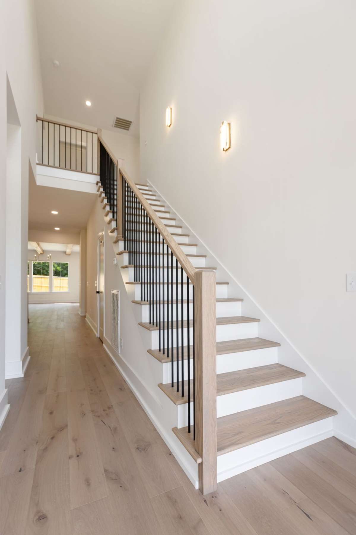 25' Ceilings with Beautiful Staircase.