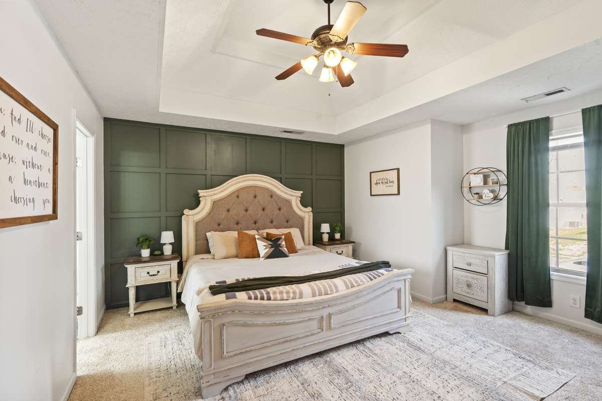 Primary Bedroom with full feature wall