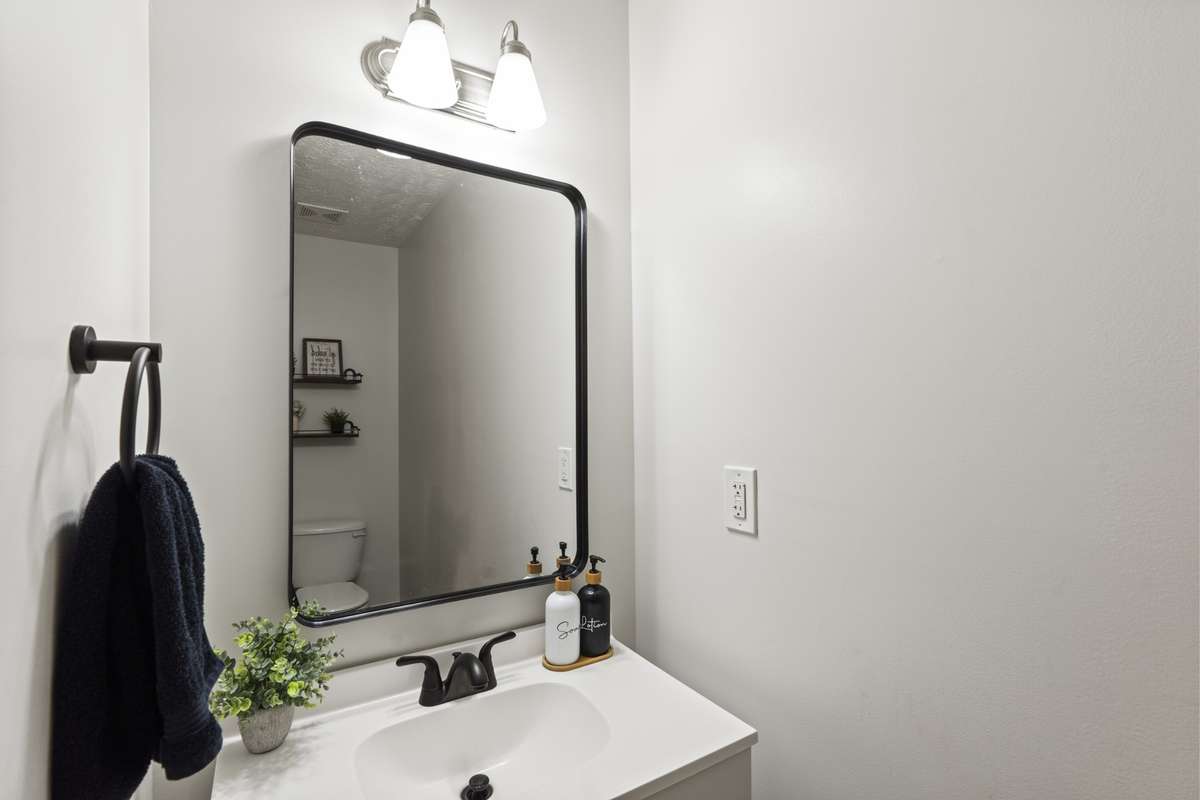 Half bathroom tucked away on the first floor