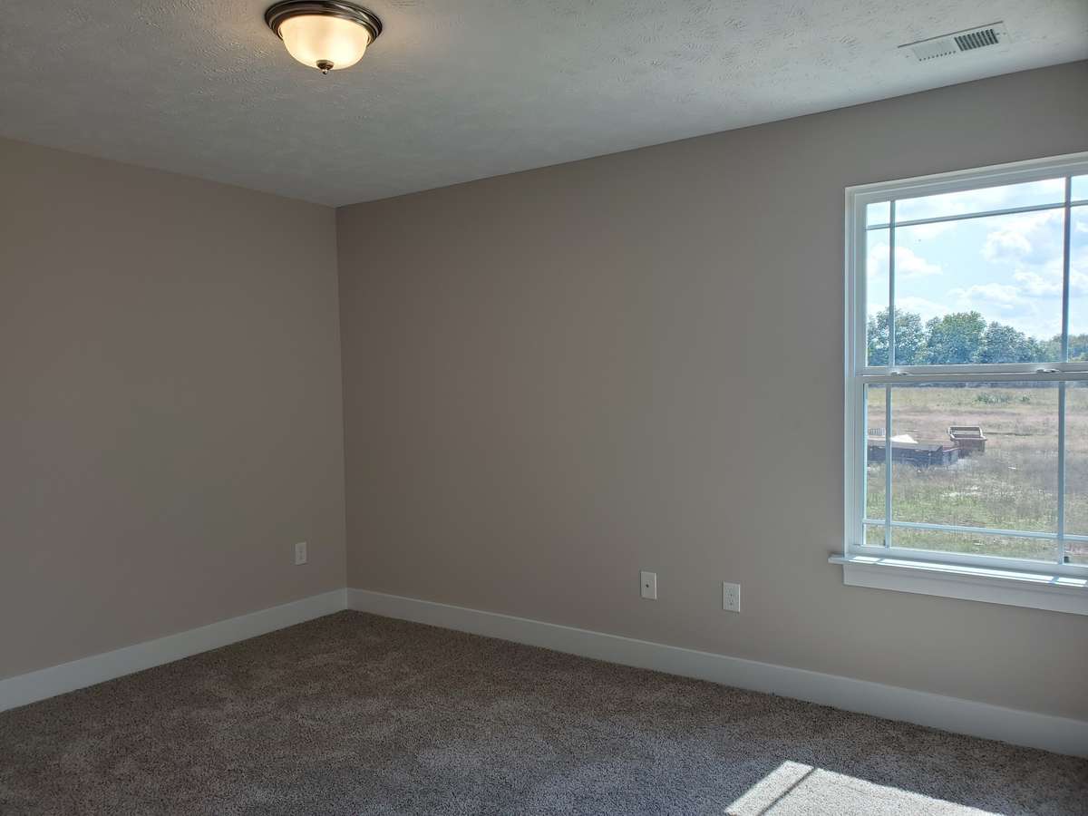 Three Large Bedrooms are Upstairs.  Picture of Previous House.