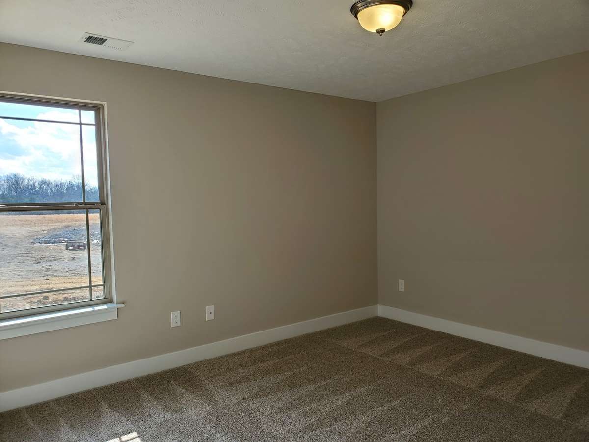 All of the 3 Bedrooms are Spacious and have Extra Wall Space. Previous House is shown.
