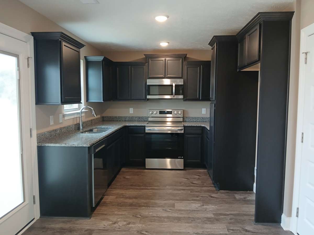 Kitchen has Upgraded Cabinets and Granite Counter Tops.
Picture of Previous House.