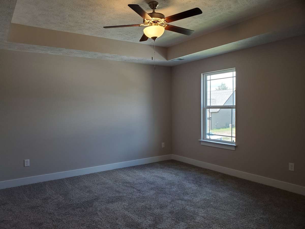 Owner's Suite is Upstairs and has a Trey Ceiling.  Picture of Similar House.