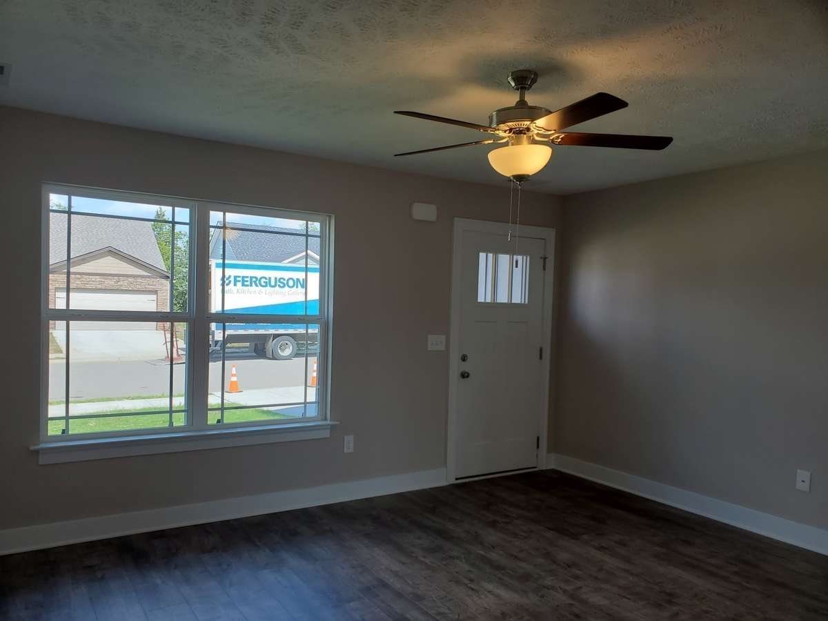 Beautiful and Durable LV Plank Flooring in the Living Room.  Buyers can select color of LVP Flooring. Picture of Similar House.