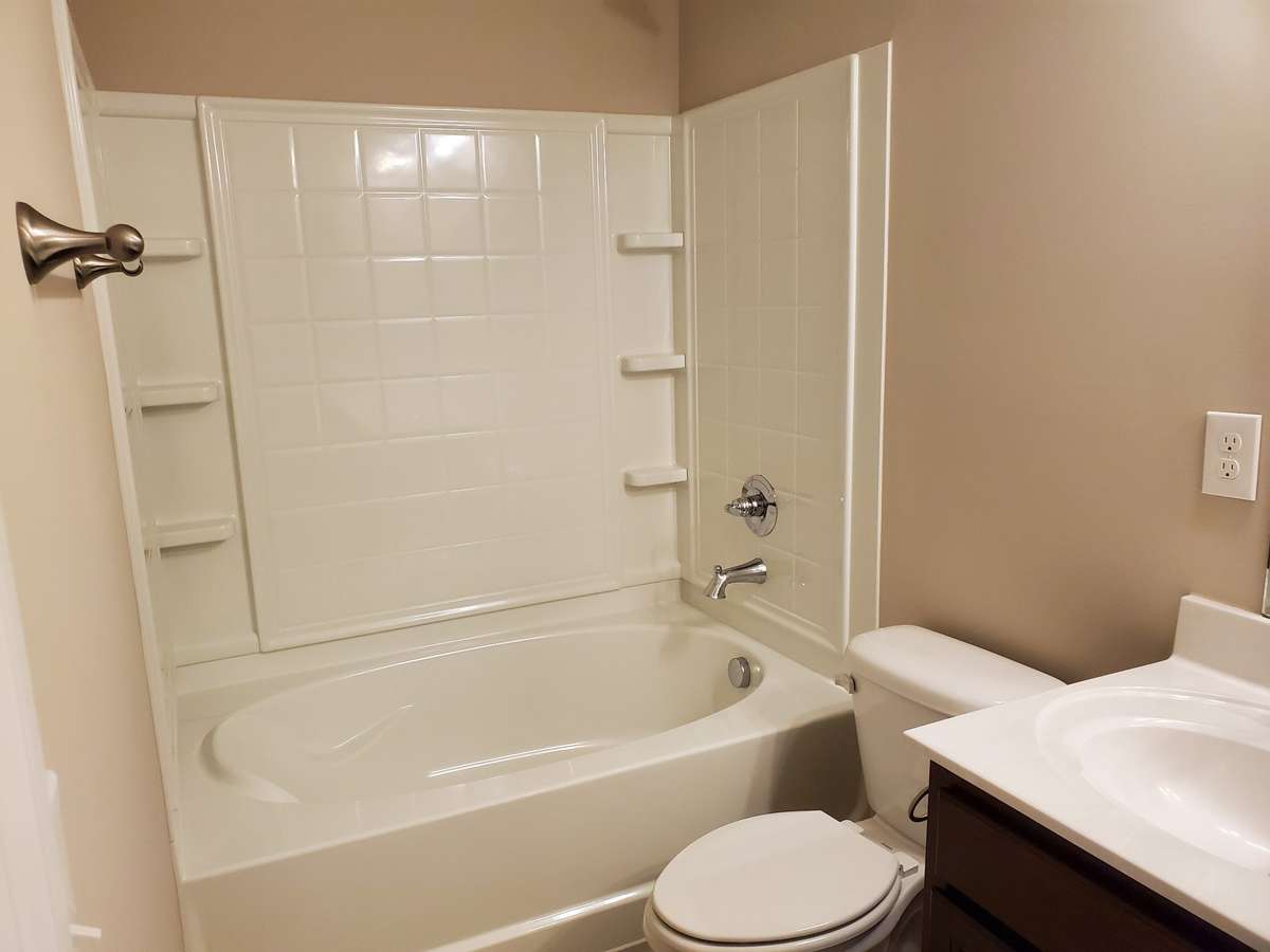 Primary Bath has Large Garden Tub & Shower Combo.  Previous House is pictured.