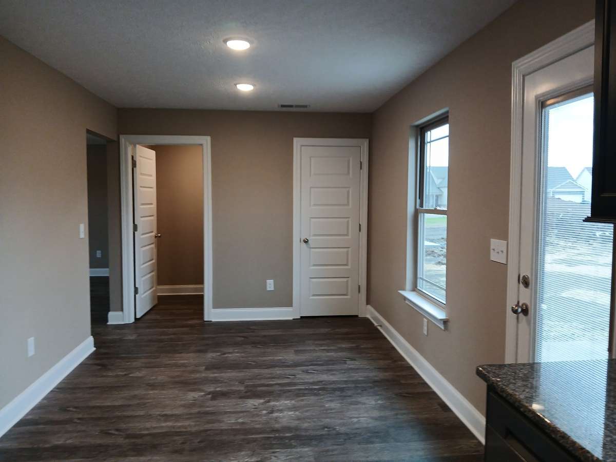 Dining Room with Plank Flooring and Pantry.
Picture of Previous House.
