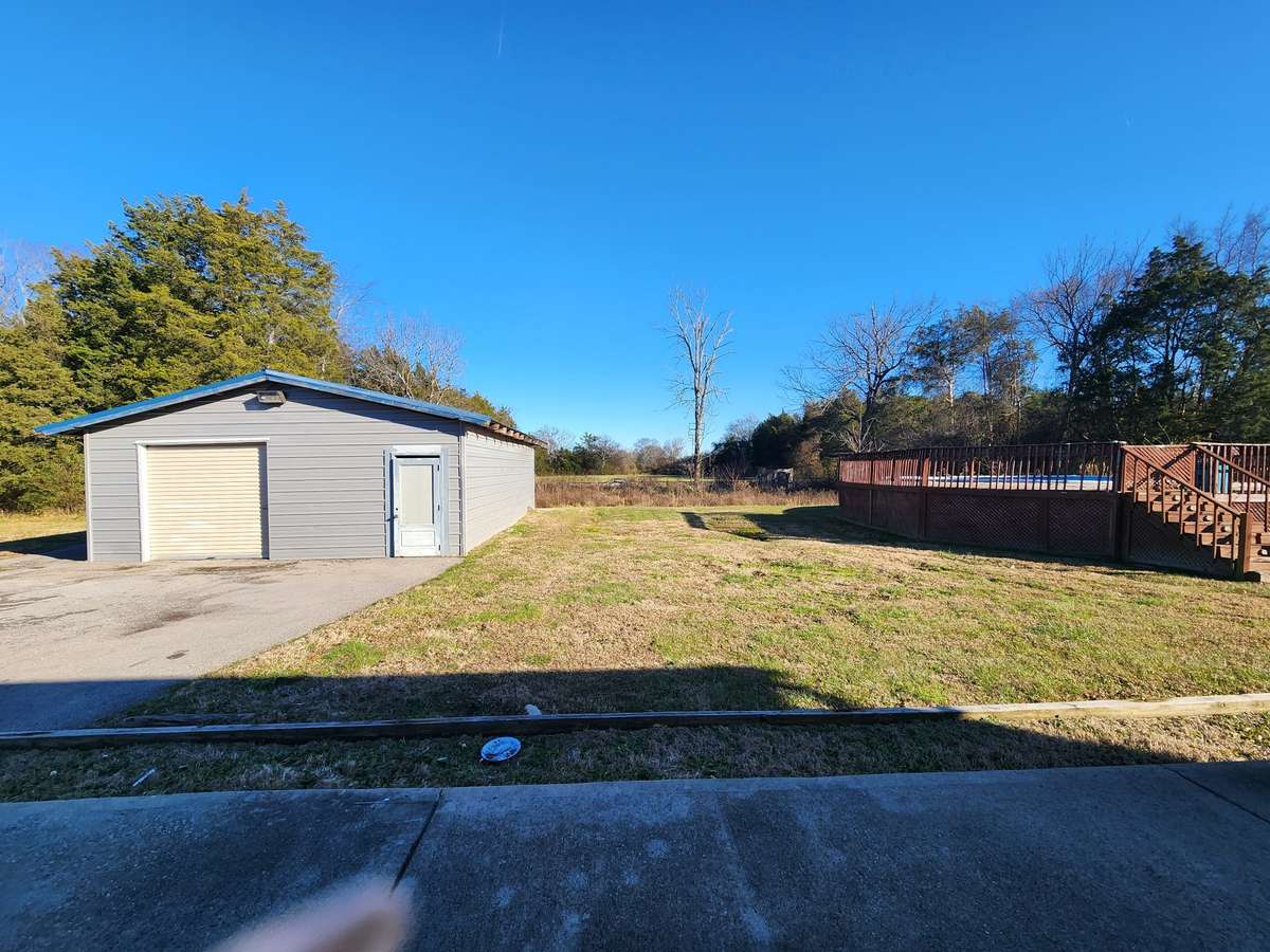 Detached Garage and Swimming Pool in Large Private Backyard.