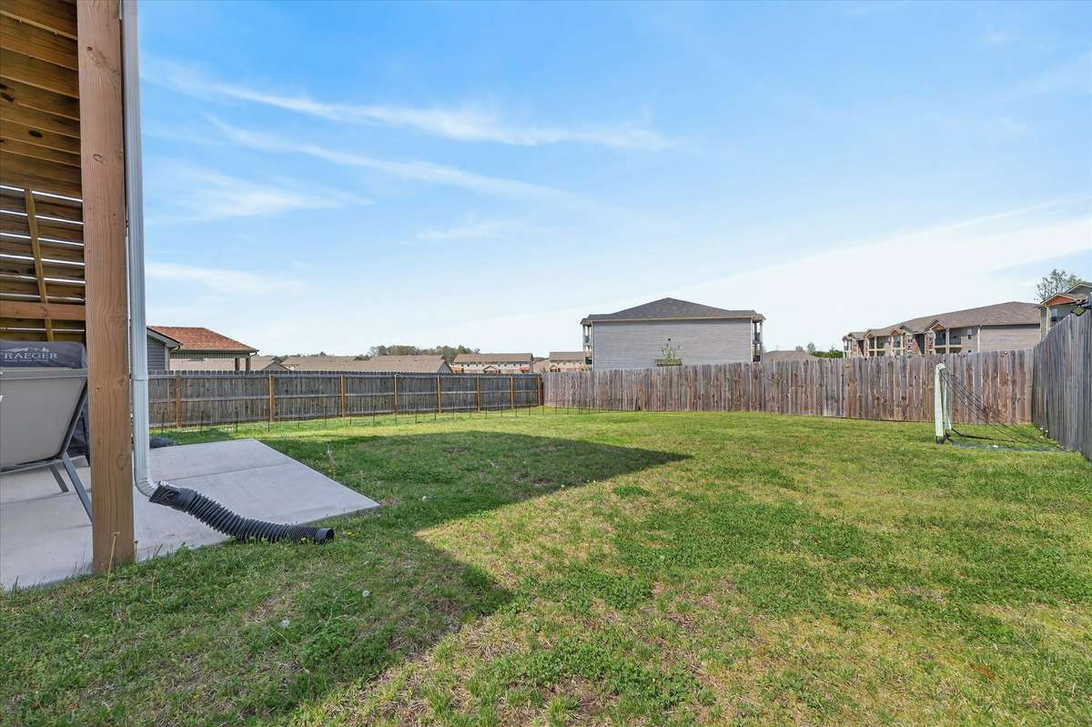 This backyard is fully fenced in with a privacy fence