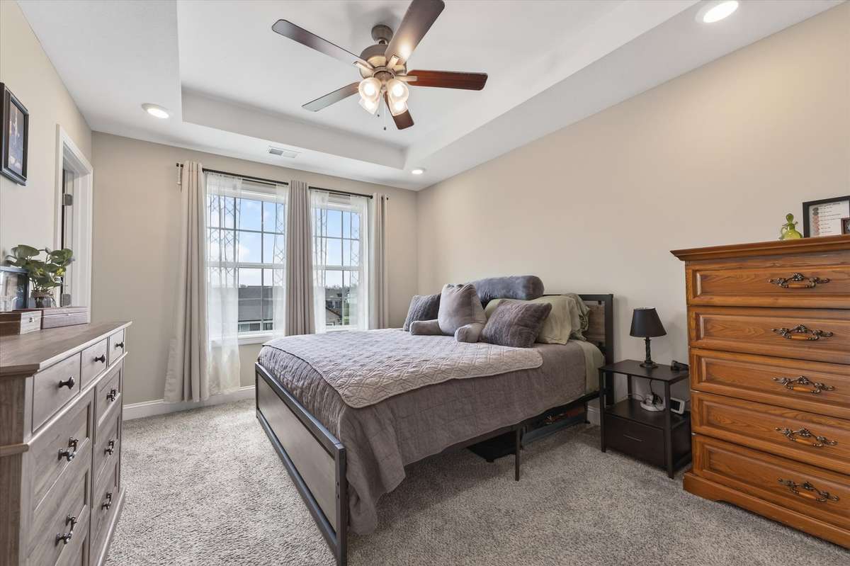 The primary bedroom has a peaceful vibe to relax