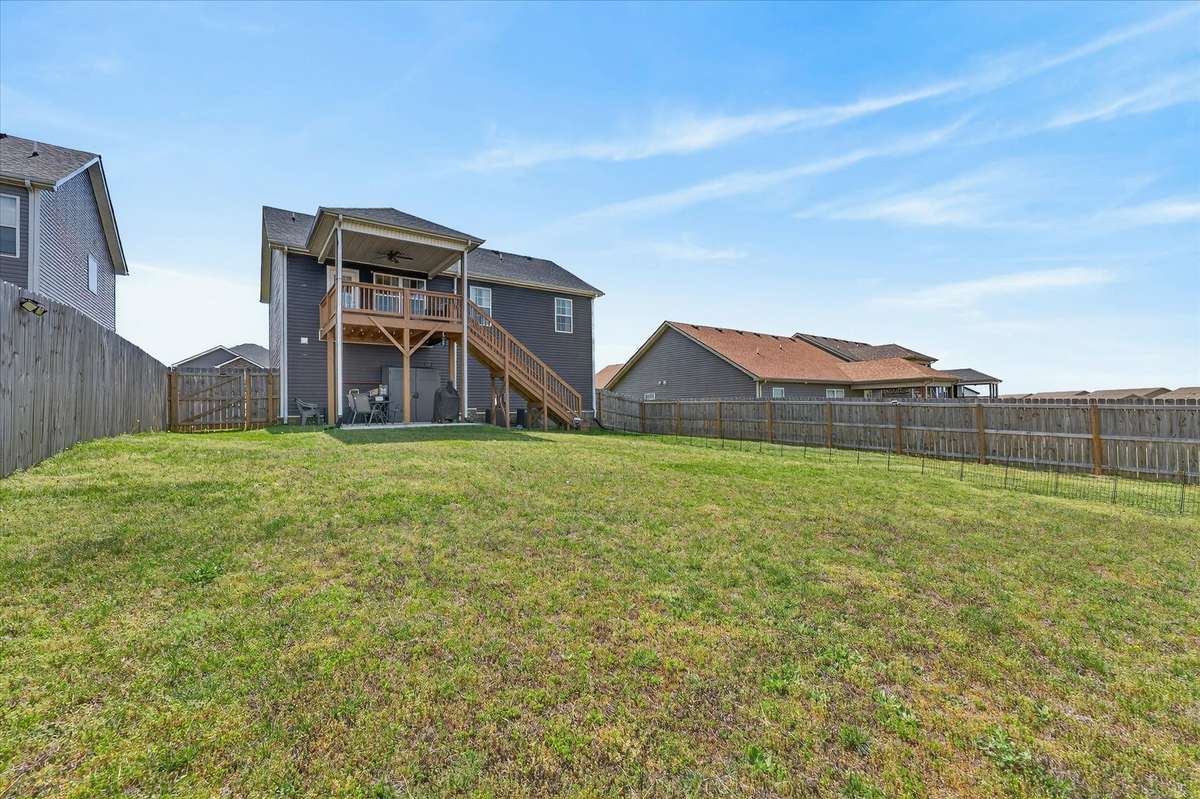 This yard offers a versatile space ideal for relaxing, entertaining, or letting those fur babies roam